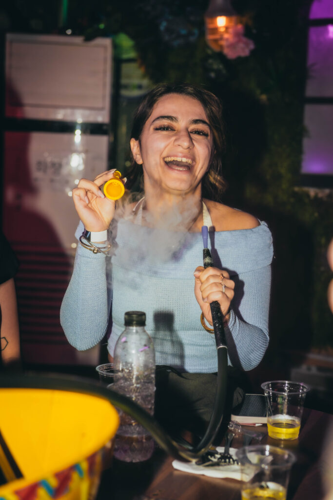 guest blowing bubbles with hookah+